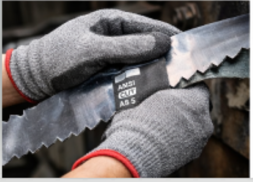 Cut-resistant gloves with ANSI rating handling sharp metal materials safely
