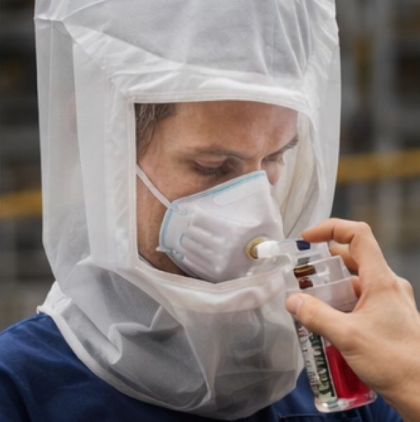 Qualitative respirator fit test using hood and solution spray for seal verification